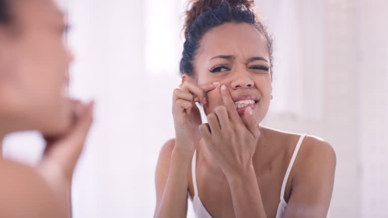 Acne, skin and woman in bathroom for skincare, pimple and worry, treatment and prp facial with mockup background. Black woman, worry and breakout in a mirror, sensitive skin and dermatology problem