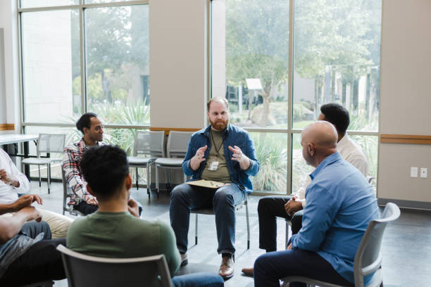 istock Therapy group speaker addresses the men 1451156537