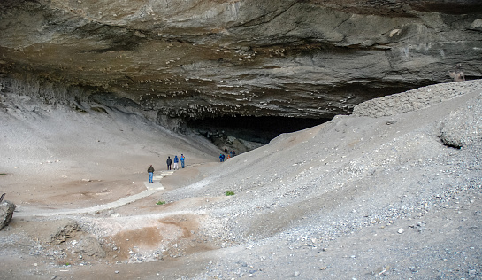 Puerto Natales, Cueva del Milodon - nov 13, 2006 : tourists enter the Cueva del Milodon, near Puerto Natales in Chile. Important fossil remains of prehistoric mammals have been found here