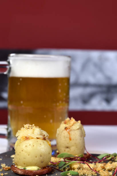 istock baked potato stuffed with draft beer in the background 1451167416
