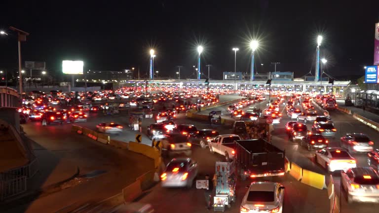 Long Shutter Time Lapse of Long Lines of Cars Crossing the US-Mexico border at Tijuana/San Ysidro into San Diego, California, US