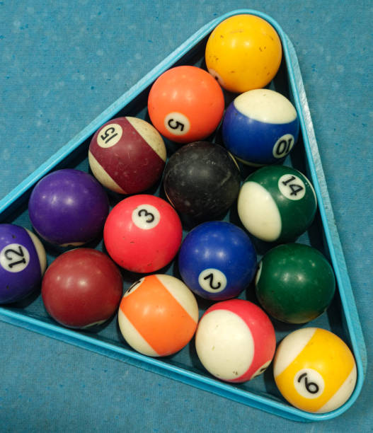 istock Pool ball on pool table before game
Sports pool balls arranged in triangle shape on blue pool table in pub. 1451180543