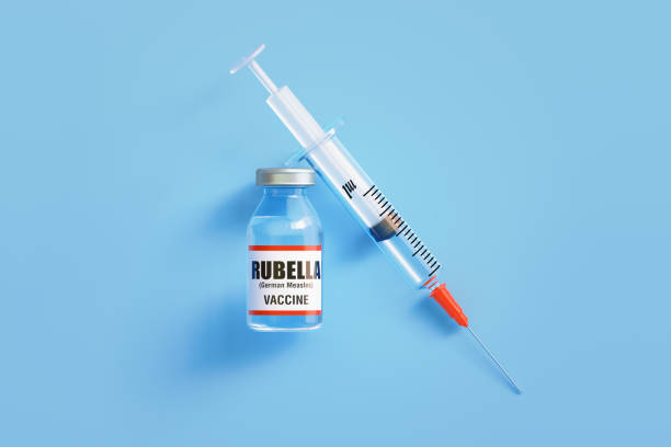 istock Rubella Vaccine and Syringe On Blue Background 1451180556