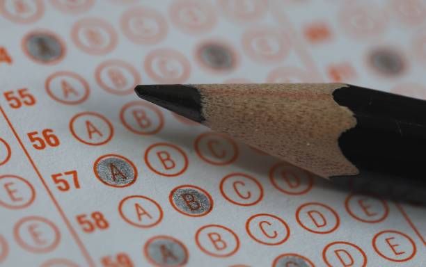 istock FILLING THE EXAM PAPER 1451180827