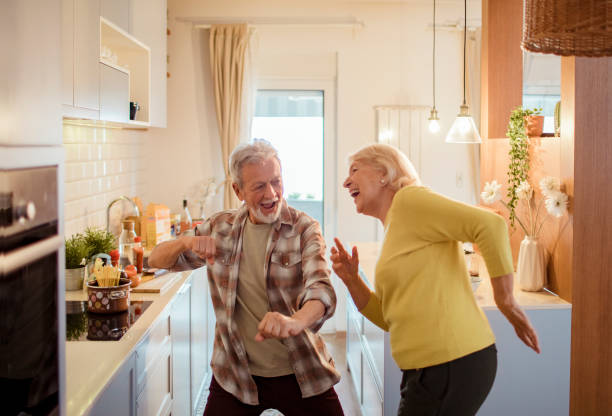 istock Senior couple dancing at home 1451182652