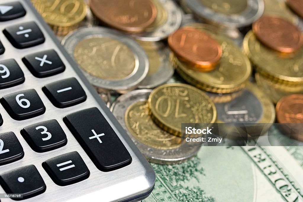 Calcolatrice e denaro - Foto stock royalty-free di Affari
