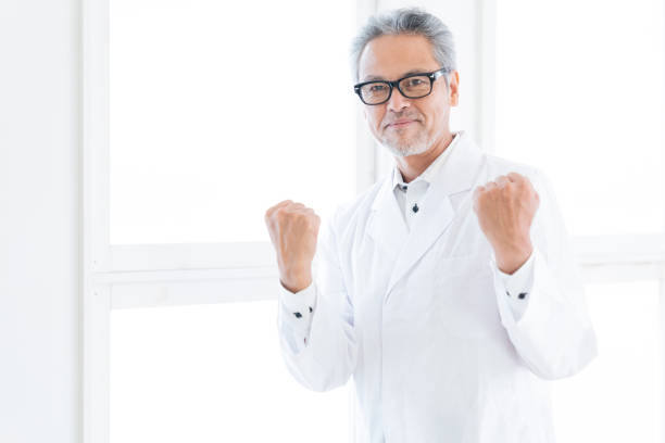 man with a mad hair and a labcoat infront of a blackboard,, holding a piece of chalk