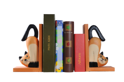 two wooden cats - decorative supports for books