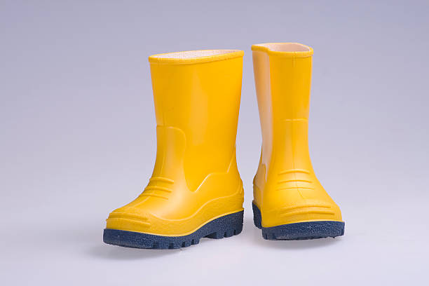 Yellow rubber boots stock photo