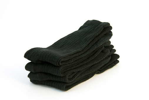 A stack of black socks, isolated on a white background. Clipping path included for Large downloads.