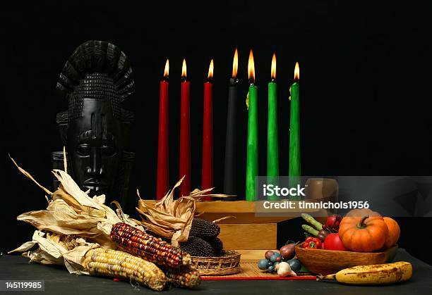 Kwanzaa Table Setting With Candle And Dried Corn Cobs Stock Photo - Download Image Now