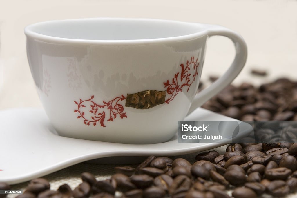 Cup of coffee and grains over sackcloth Above Stock Photo