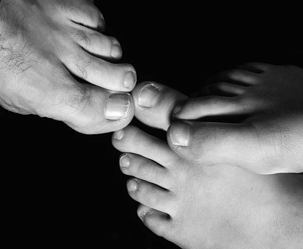 Black & white of toes and feet stock photo