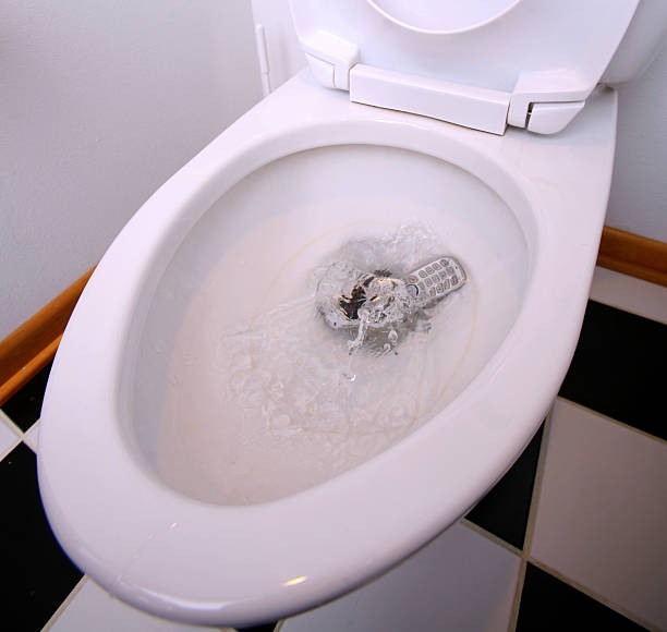 istock Phone Splashing into Toilet 145121795