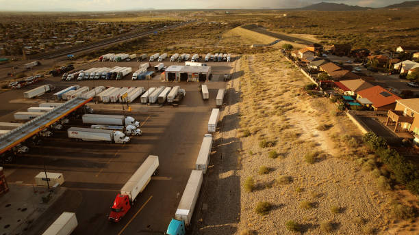 istock Semi trucks parked on a resting station in Texas, USA - drone 1451220063
