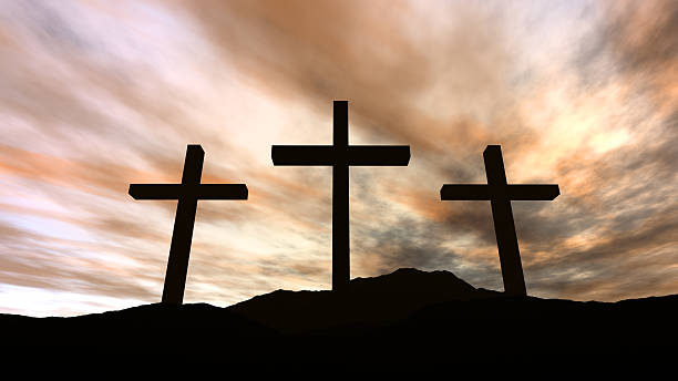 istock Golgotha - silhouette of three crosses on a hill with clouds 145122174