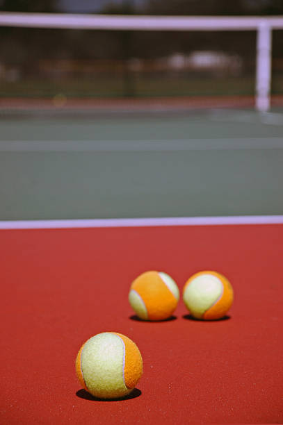 istock Multi Colored Tennis Balls on Court 145122392