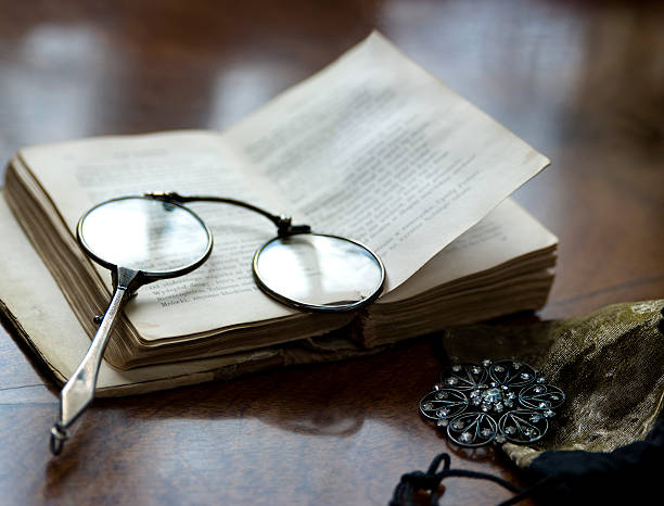 lorgnettes and antique book