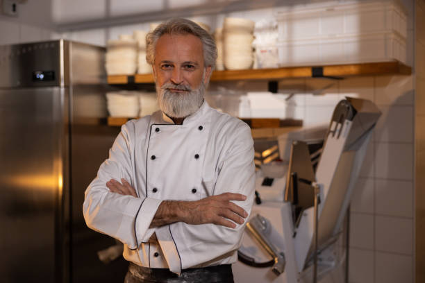 istock A baker prepares bakery products in a bakery 1451228215