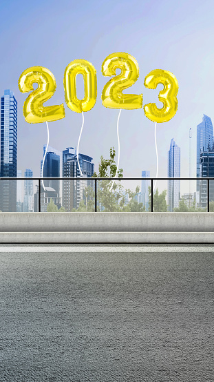 The balloon of 2023 with a cityscape background. Happy New Year 2023