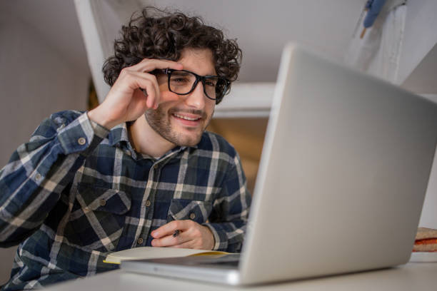istock Young fashionable man working at home 1451229505