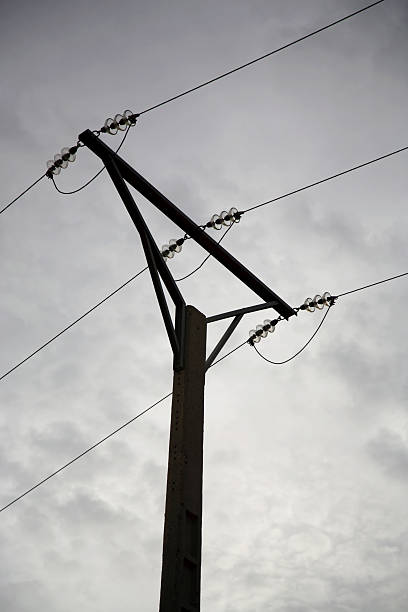 istock Powerline silhouetted against the clouds 145122957