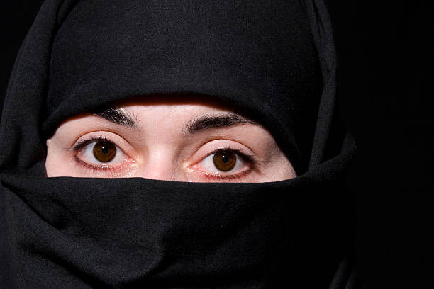 Terrorist war criminal men make a crime thief in black dress head shot. Bad anonymous soldier army with gun weapon in hand mafia attack. kidnap illegal bandit murderer. Criminal terrorist war concept