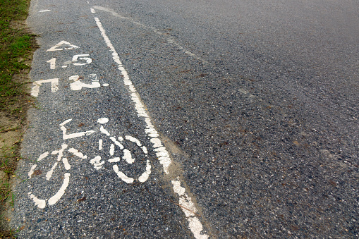 bicycle path sign made with paint on the ground