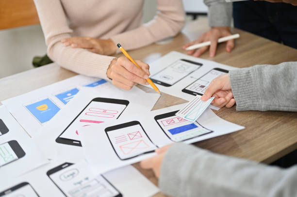 istock A team of mobile app developers discussing on their new mobile app interface design. cropped 1451246519