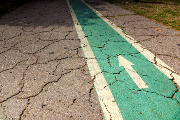 istock Directional arrow signs on asphalt road 1451246597