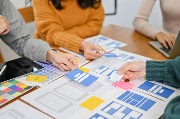 istock A team of professional mobile app developers and designers are discussing on their new app 1451246718
