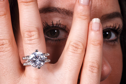 Close up beautiful white young woman and diamond ring