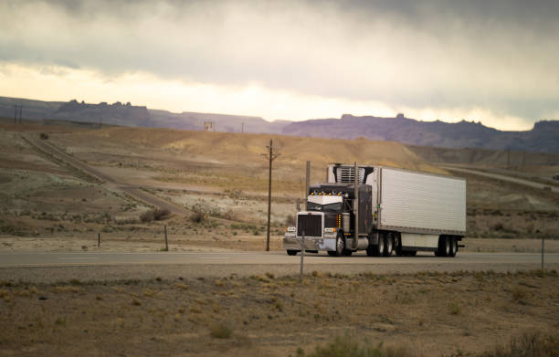 istock Semi-truck driving on the highway 1451254316