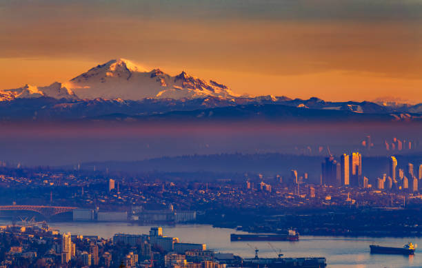 istock Foggy Sunset Colours, Greater Vancouver with Mt Baker at sunset 1451254634