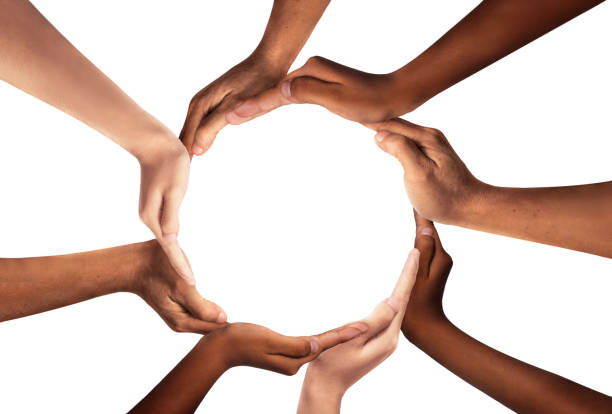 istock Conceptual symbol of multiracial human hands making a circle on white background with a copy space in the middle. 1451254827