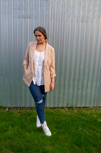 young beautiful woman in a jacket and jeans