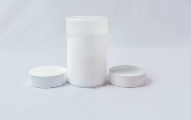 istock Swimming pool cleaning and maintenance chlorine tablets. Chlorine tablets for pool cleaning on isolated background. Chlorine tablets for swimming pool disinfection on white background 1451260688
