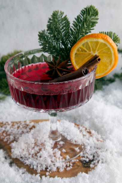 istock Festively stylized cocktail on the snow and scattered spruce branches 1451260853