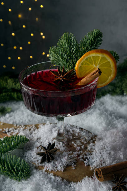 istock Festively stylized cocktail on the snow and scattered spruce branches 1451260872