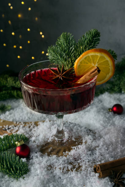 istock Festively stylized cocktail on the snow and scattered spruce branches 1451261006