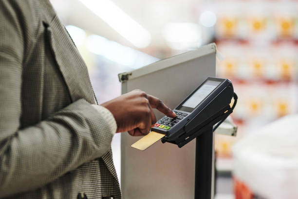 istock Credit card, supermarket and payment with hands typing password on machine for security. Finance, customer and black woman at grocery store checkout paying with cashless bank transaction. 1451277608
