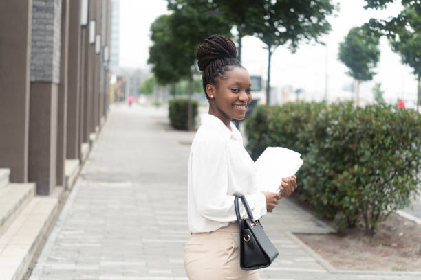 istock Happy Afro businesswoman going to work 1451281100