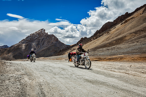 Ladakh, India - September 2, 2011: Bike tourists in Himalayas on famous high altitude Leh-Manali Highway. Himalayan bike tourism is gaining popularity for tourists and bikers from all over the world