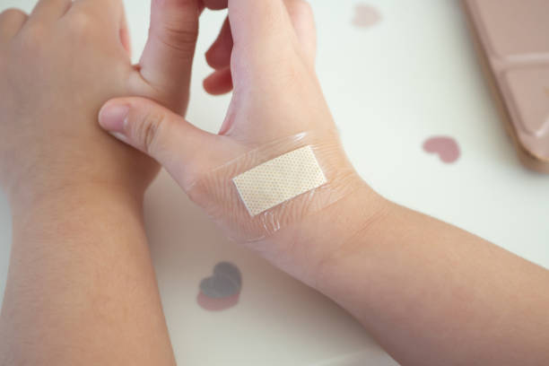 istock waterproof adhesive plaster on little kid hand 1451283499