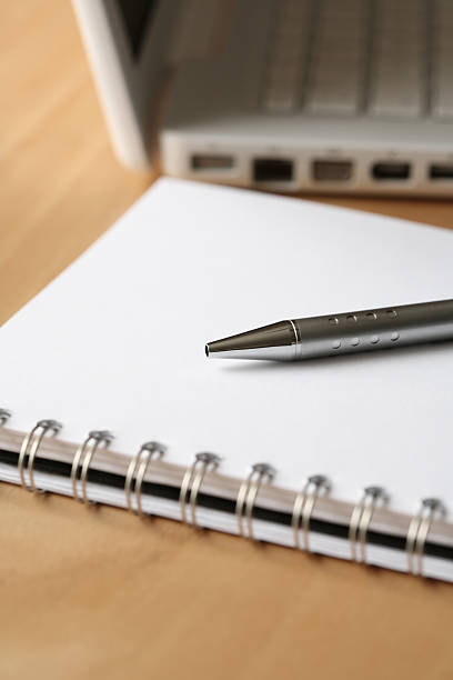 istock pen paper and laptop 145128451