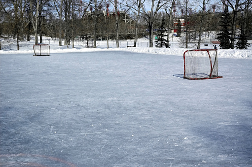 Outdoor skating rink covered ready for the game to start.