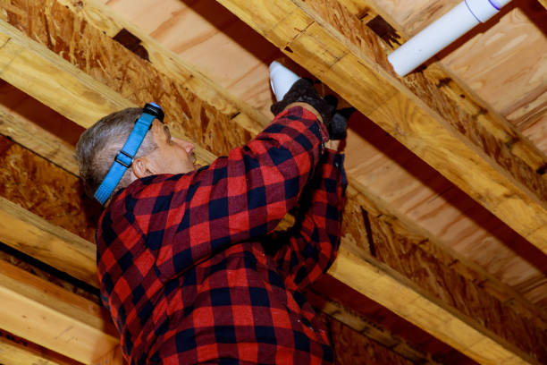 istock Plumber putting glue on a pvc pipe, plumber joining plastic pipes using cement glue for new home construction 1451292716