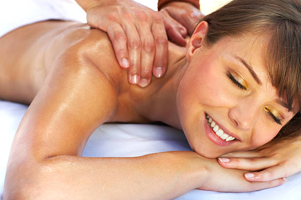 istock Beautiful young woman getting a back massage 145129310