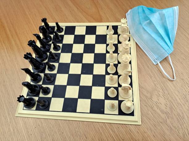 istock Close-Up Of Chess Pieces On Chessboard Game Beginning 1451293583