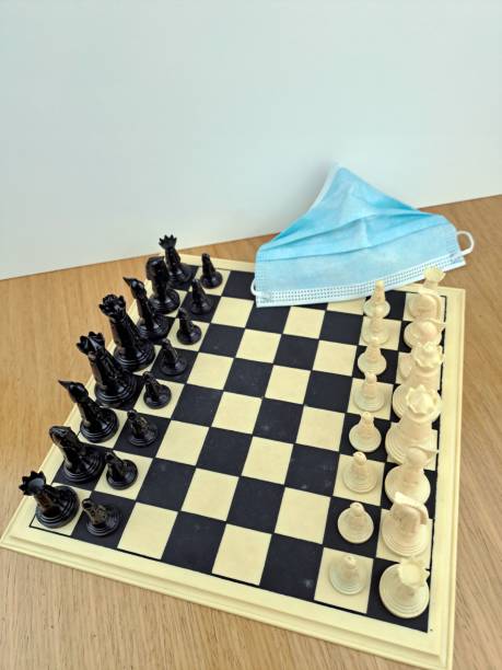 istock Close-Up Of Chess Pieces On Chessboard Game Beginning 1451293593